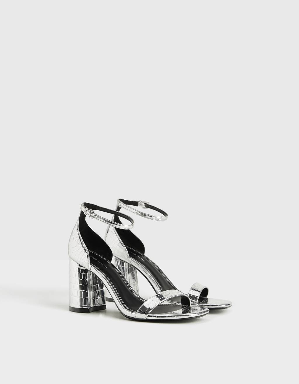 Metallic sandals with embossed animal print