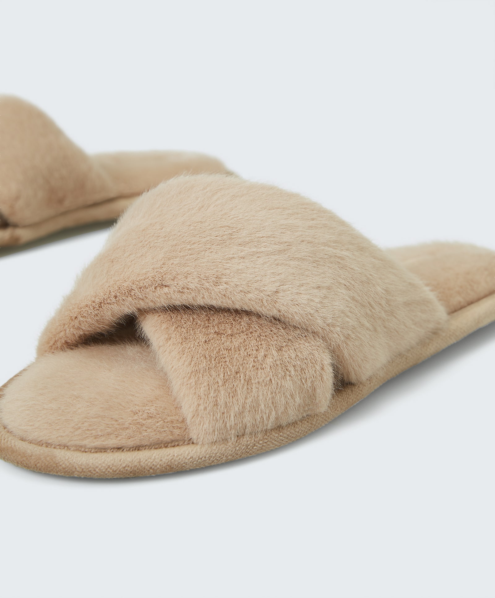 Faux fur slippers with crossover upper